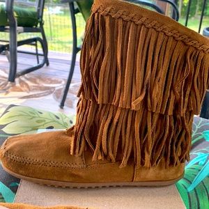 Brand new Minnetonka  size 8.5 fringed boots . Moccasin style